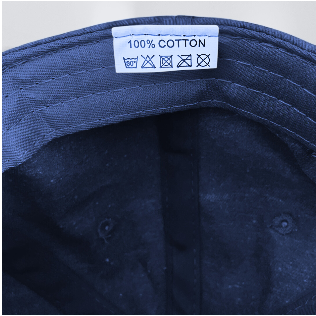 Label on baseball cap for cancer patient stating that it is 100% cotton