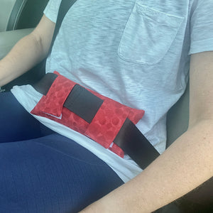 Red Seat Belt Pillow placed by abdomen