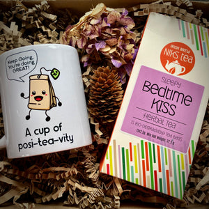 Cup of Posi-tea-vity mug with wellness tea in a gift box