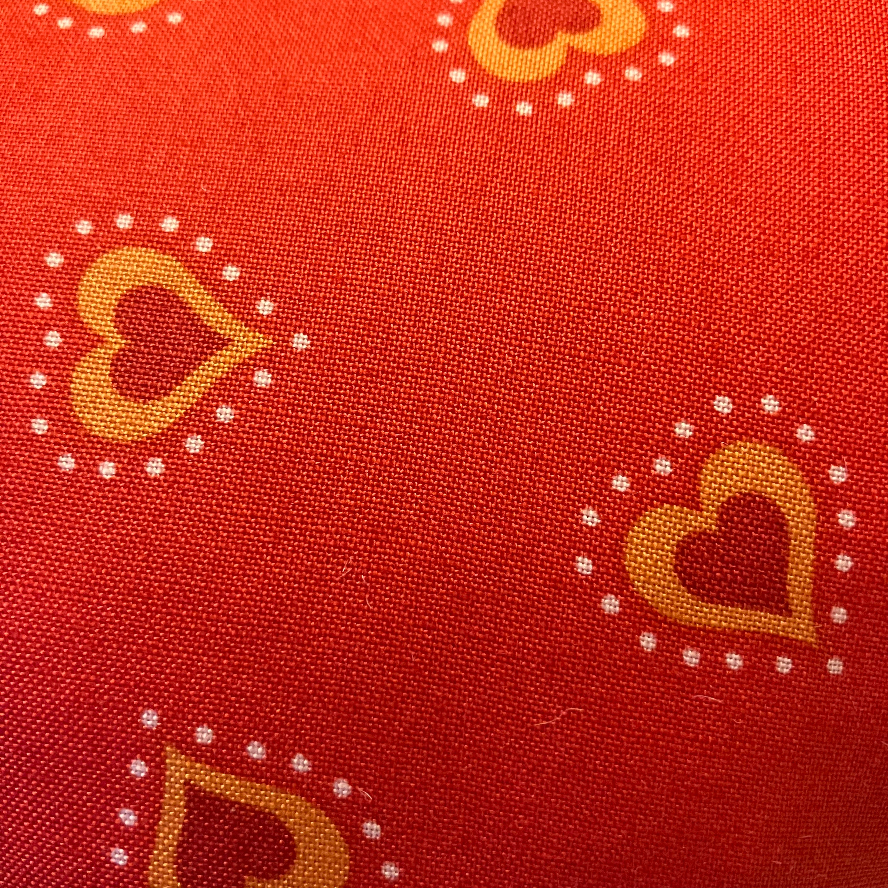 Close up of red mastectomy cushion demonstrating the quality cotton